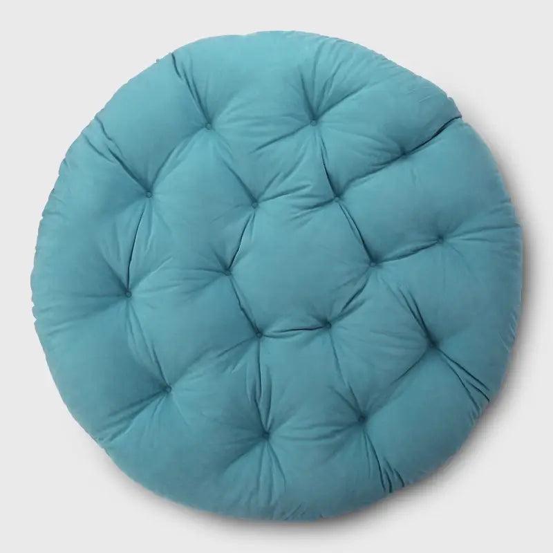 A larger cushion that fits into the bowl-shaped frame of the papasan chair, serving as the seat cushion. | Rulaer