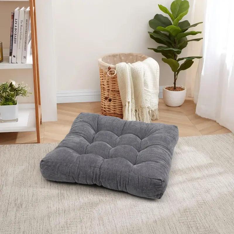 The scene of Square Tufted Floor Pillow for Living Room with gray color, designed with nine-pins, is super soft and perfectly fit your study room or backyard ground. | Rulaercushion
