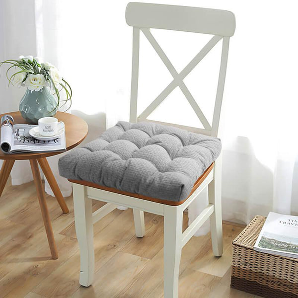 Sleek, solid-colored cushions in contemporary setting